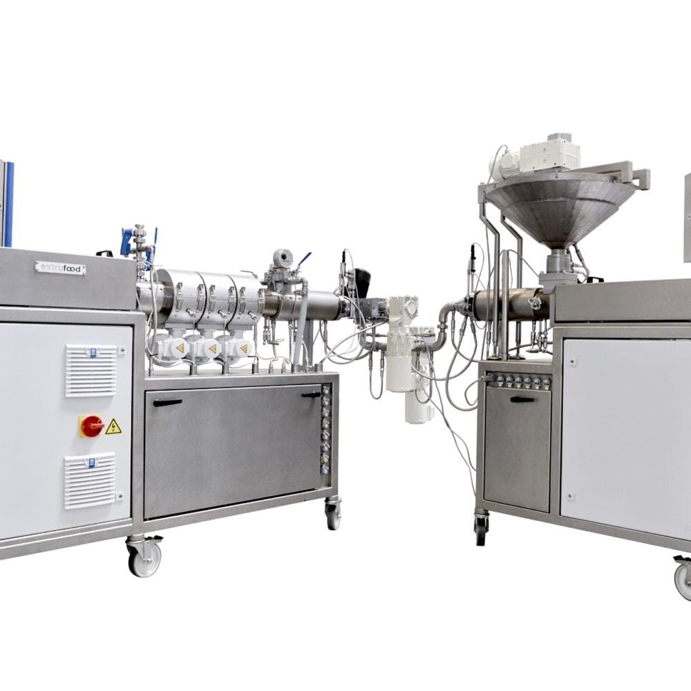 Extrufood lab line — two wheeled tabletop extruder units connected for R&D and recipe testing at small batch scale